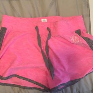 These are justice athletic shorts in bright pink